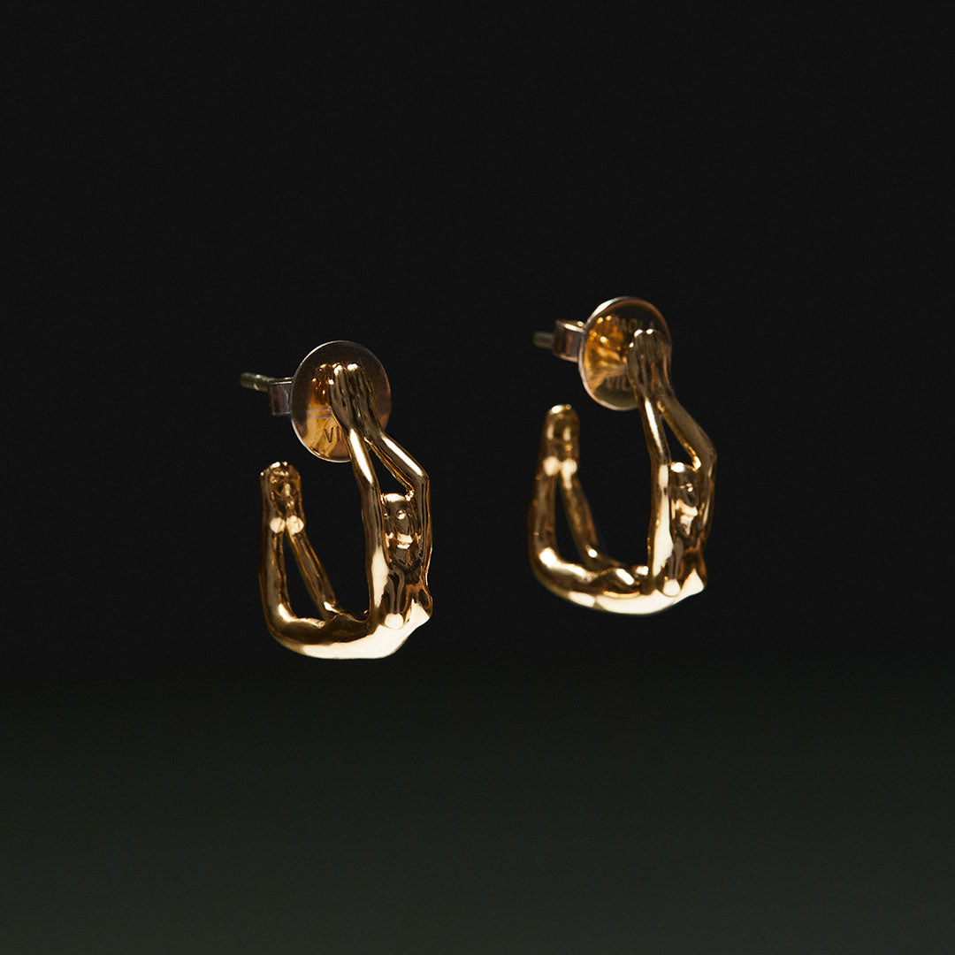 18k gold hoop earring of female bodies