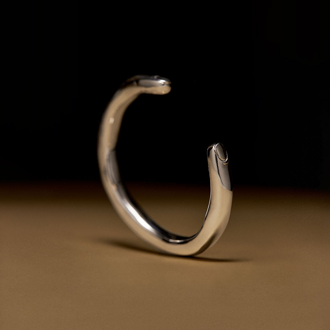 Surrealist finger bracelet in sterling silver