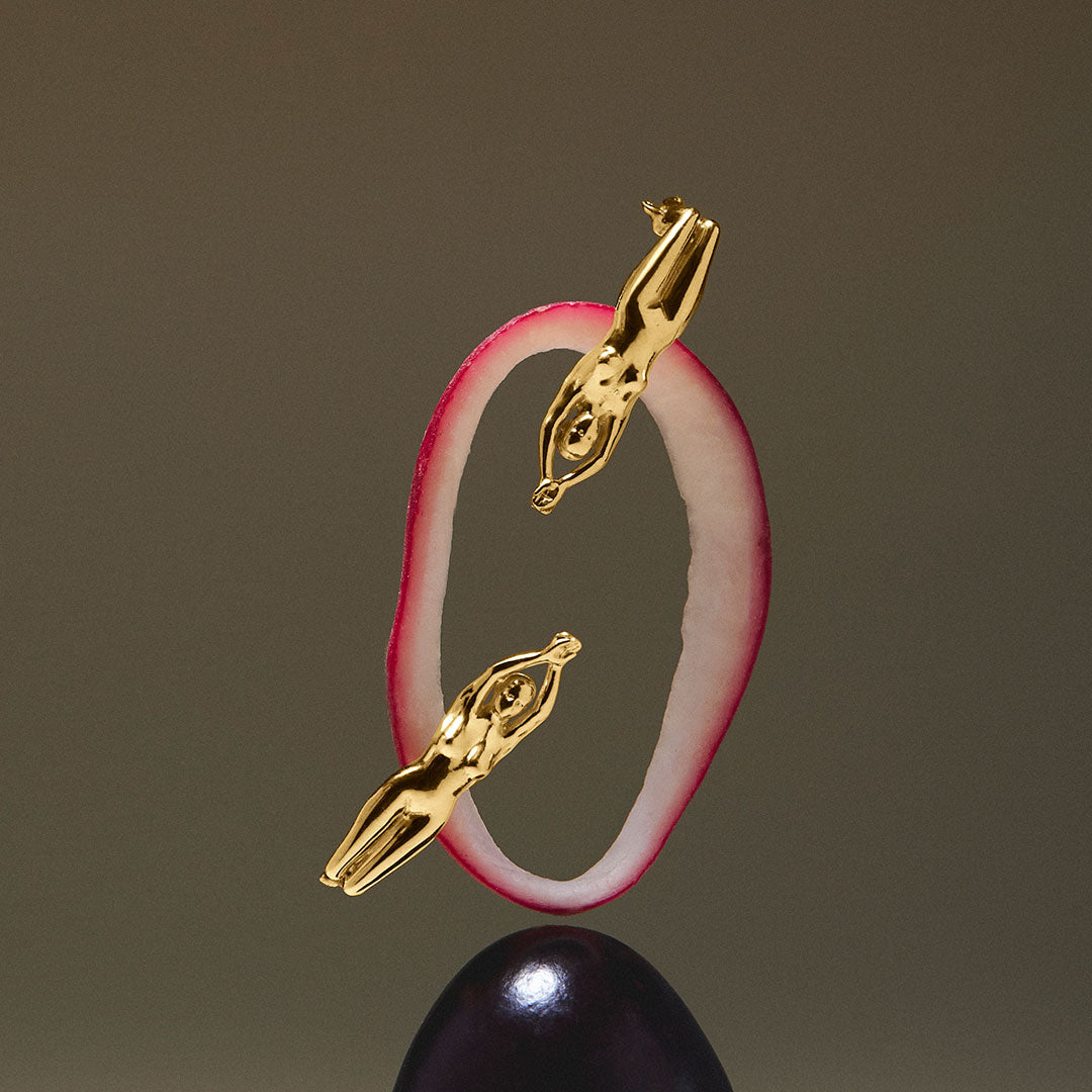 Paola Vilas earrings of a woman's body sculpture in 925 silver with 18k gold plating