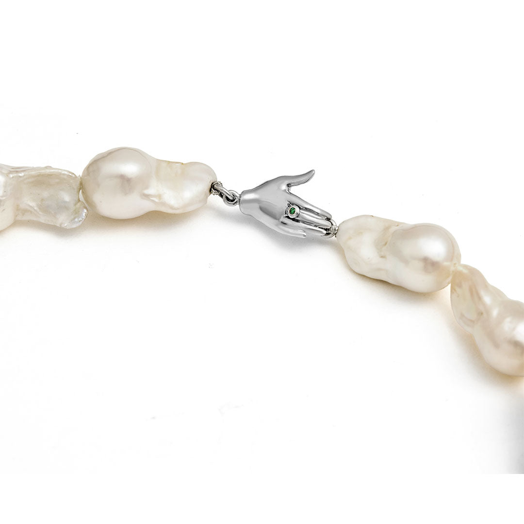 Paola Vilas necklace featuring sterling silver hand, emerald, and baroque pearls