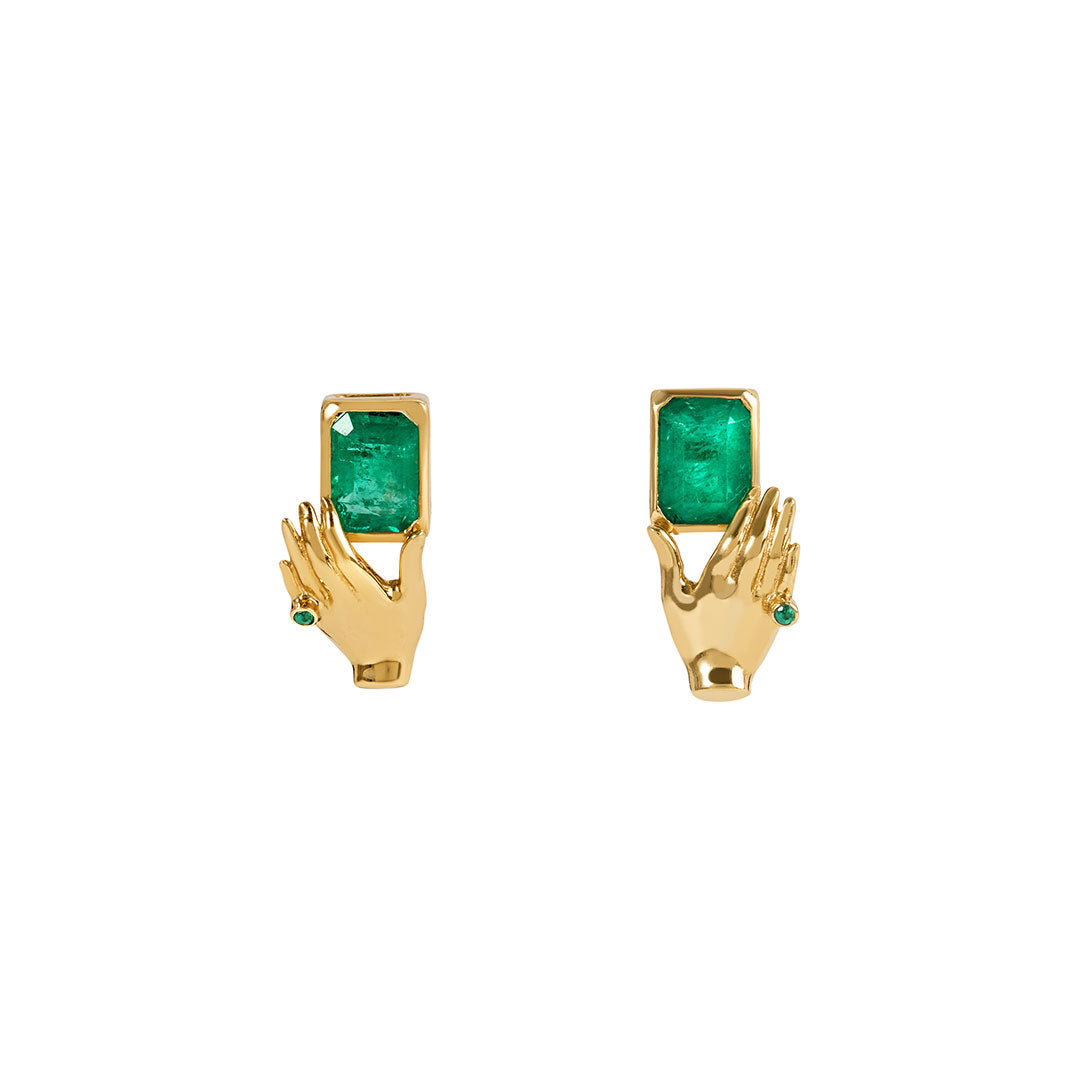 Paola Vilas 18k gold hand earrings holding rectangular emeralds