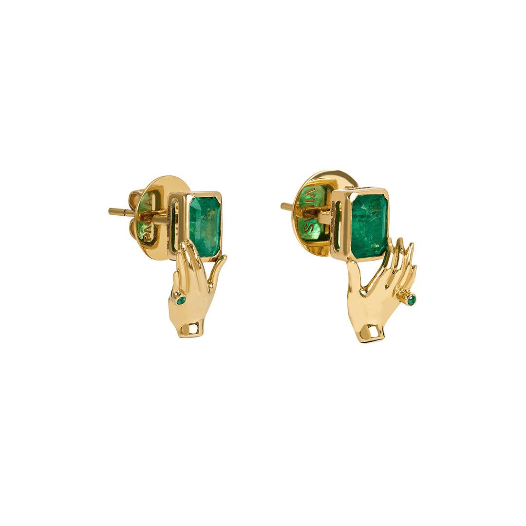 Paola Vilas earrings in 18k gold of hands holding rectangular emeralds