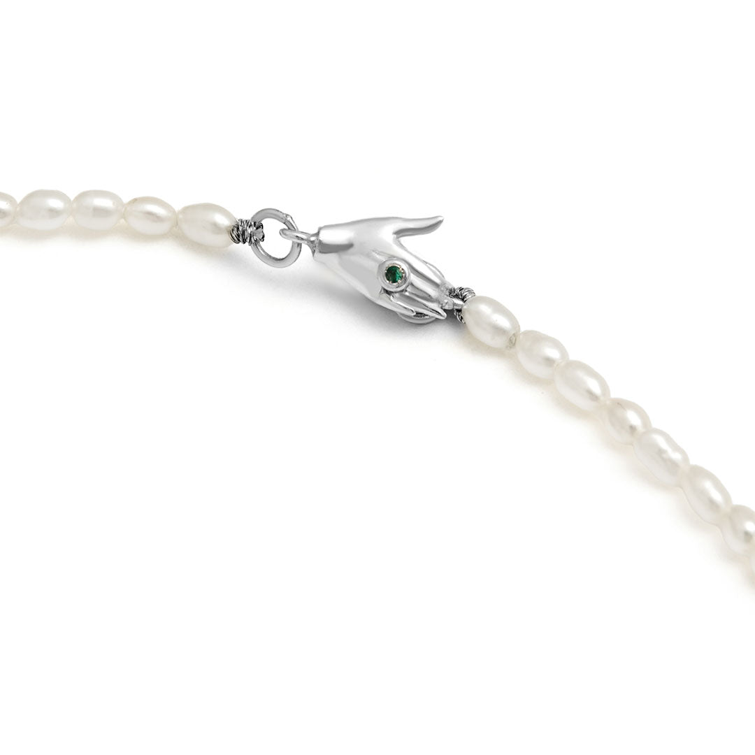 Paola Vilas necklace with hand-shaped clasp in sterling silver adorned with emerald and pearls