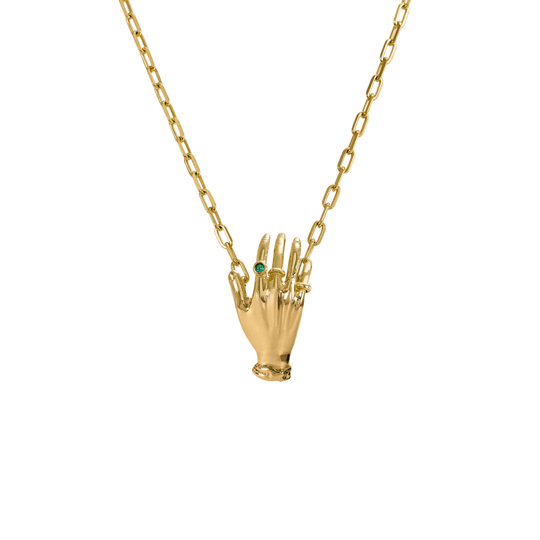 Paola Vilas necklace in sterling silver with 18k gold plating featuring a hand adorned with emerald