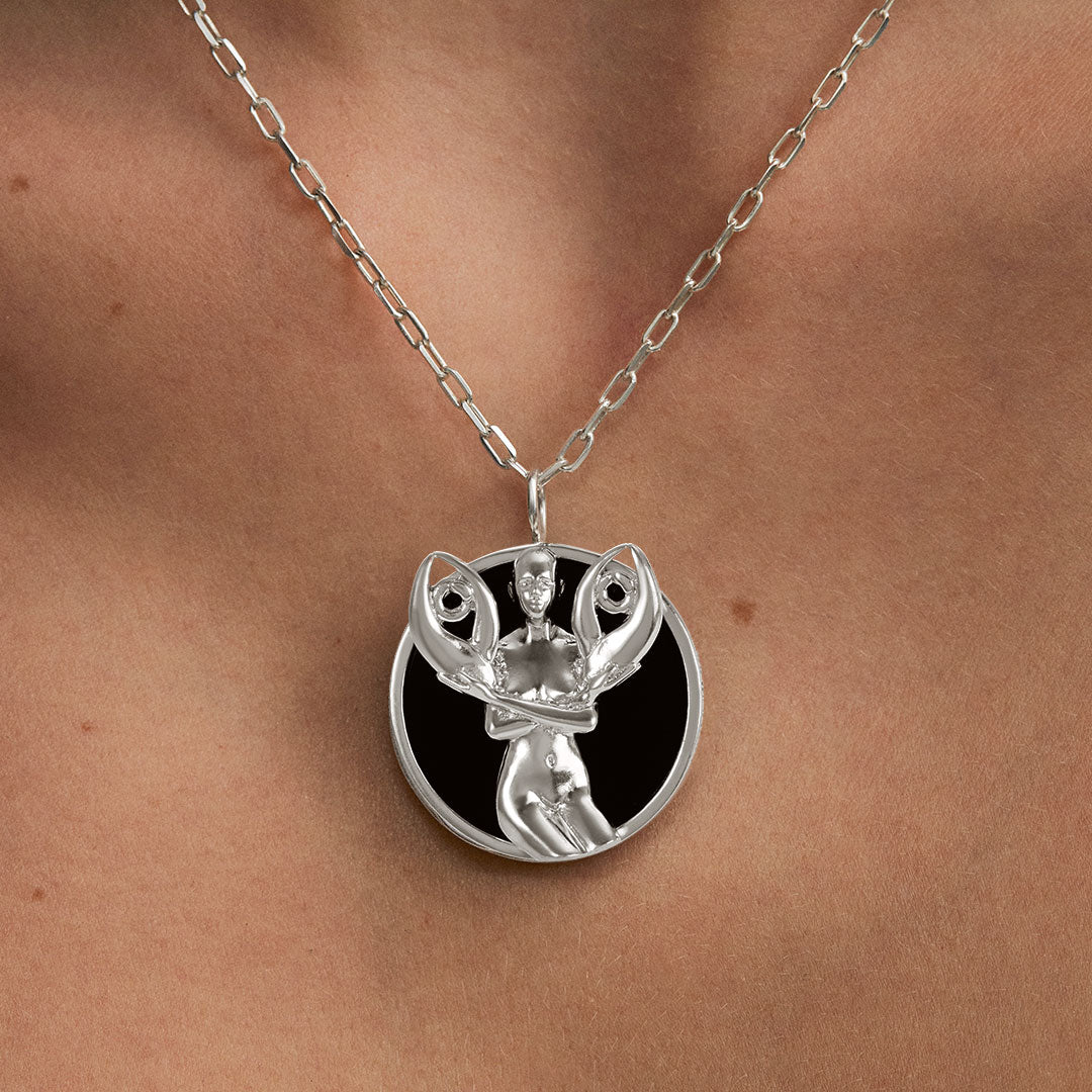 Model wearing Cancer zodiac necklace in sterling silver