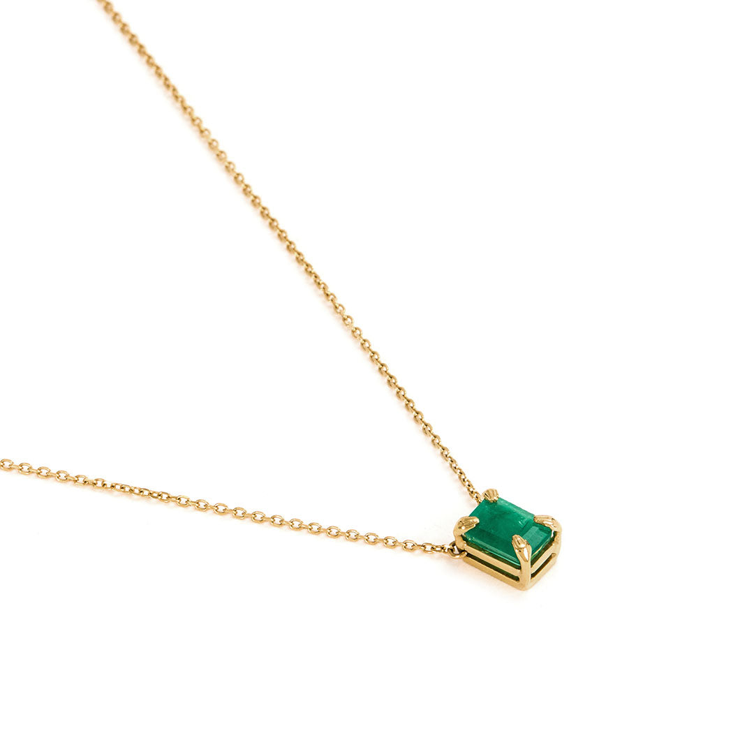 Paola Vilas necklace with 18k gold hands and rectangular emerald