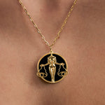 Model wearing Libra zodiac necklace in sterling silver with 18k gold plating