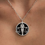 Model wearing Libra zodiac necklace in sterling silver