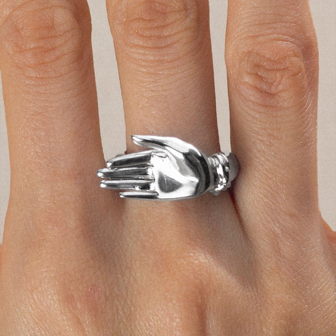 Model wearing a palm ring in sterling silver