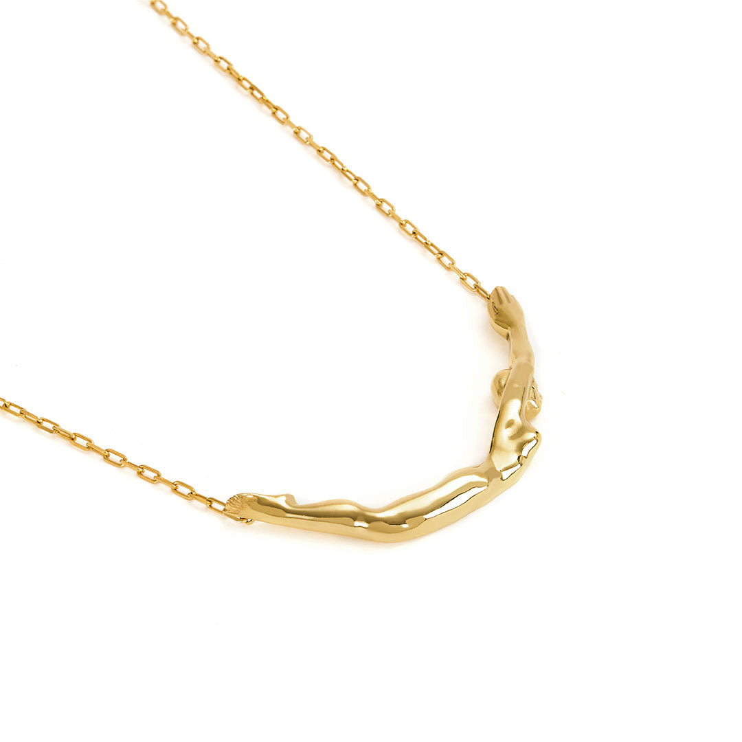 Sterling silver necklace with 18k gold plating by Paola Vilas featuring a small female body