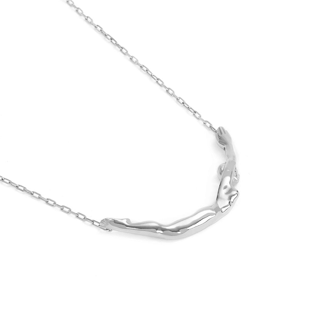 Sterling silver necklace by Paola Vilas featuring a small female body