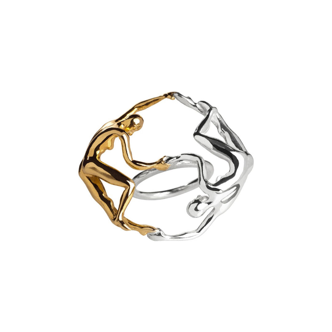 Sculptural ring of intertwined dancing bodies in sterling silver with 18k gold plating