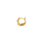 Paola Vilas 18k gold hoop piercing of a female body