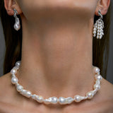 Model wearing baroque pearl necklace and sterling silver earrings