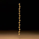 Bracelet in sterling silver with 18k gold plating featuring hand shapes in a chain adorned with emerald