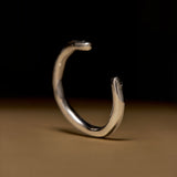 Surrealist finger bracelet in sterling silver