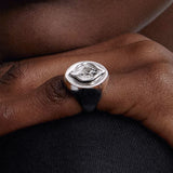 Model wearing a chevalier ring of a vulva in sterling silver