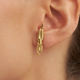 Model wearing earring of a woman's body in 925 silver with 18k gold plating
