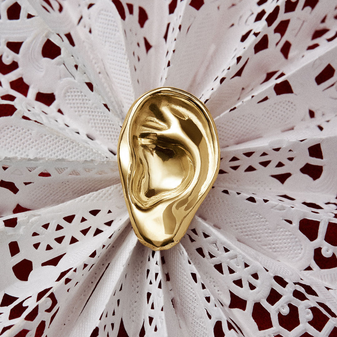 Model wearing sculpted ear earring in sterling silver