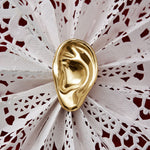 Model wearing sculpted ear earring in sterling silver