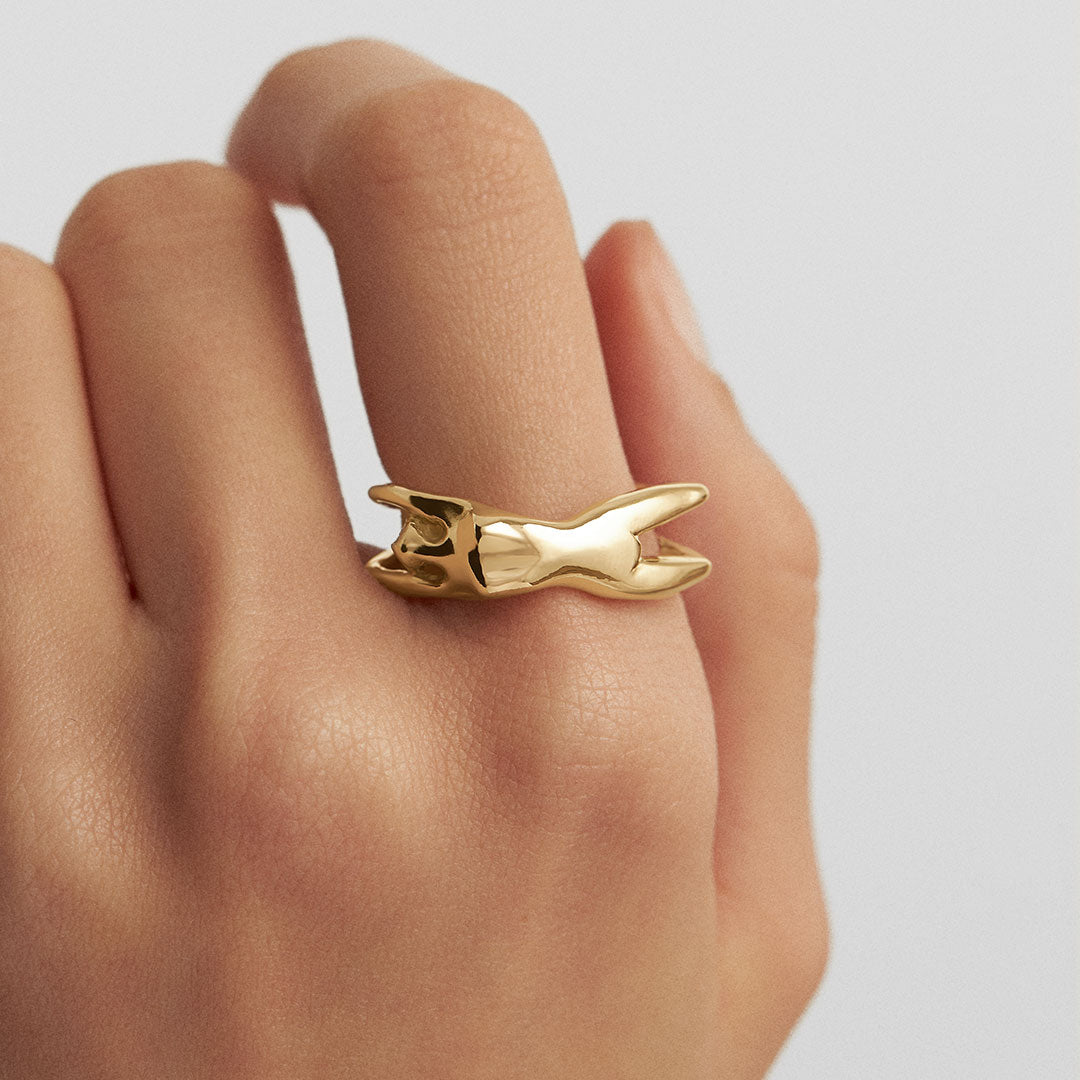 Model wearing a female body ring in sterling silver with 18k gold plating