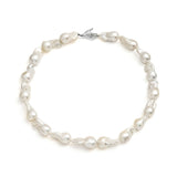 Paola Vilas necklace with baroque pearls and sterling silver hand with emerald