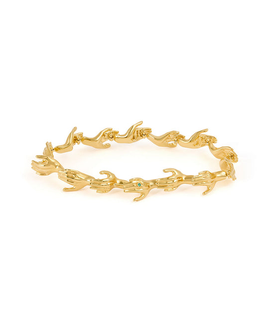 Paola Vilas bracelet in sterling silver with 18k gold plating featuring hand shapes in a chain adorned with emerald