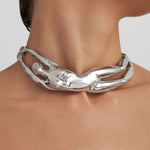Model wearing a sterling silver choker of a female body