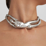 Model wearing a sterling silver choker of a female body