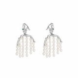 Paola Vilas earring in sterling silver featuring a hand and body with pearl strands