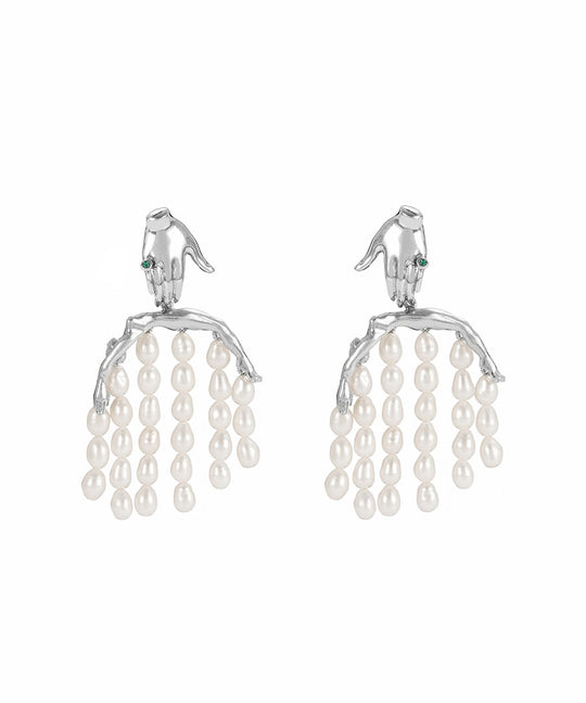 Paola Vilas earring in sterling silver featuring a hand and body with pearl strands