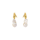 Paola Vilas hand earring in sterling silver with 18k gold plating, emerald, and baroque pearl