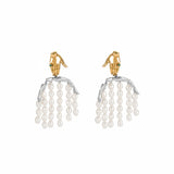 Paola Vilas earring in 18k gold-plated sterling silver featuring a hand and body with pearl strands