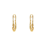 Paola Vilas earring in sterling silver with 18k gold plating featuring a safety pin and female body