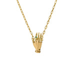 Paola Vilas necklace in sterling silver with 18k gold plating featuring a hand adorned with emerald