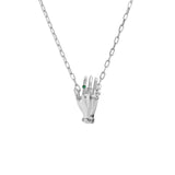 Paola Vilas necklace in sterling silver featuring a hand adorned with emerald