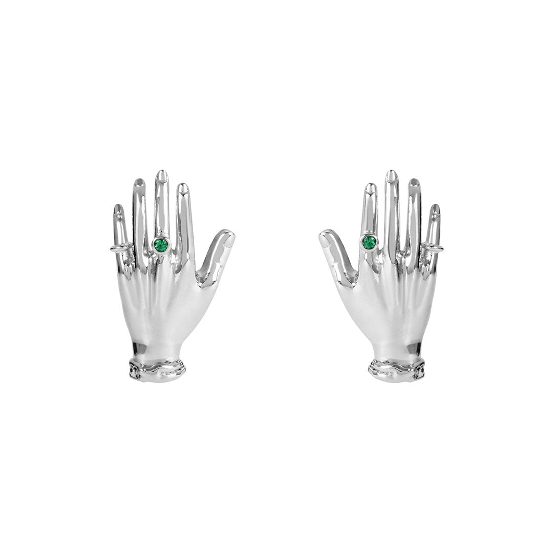 Paola Vilas earrings in sterling silver featuring sculptural hands adorned with emeralds