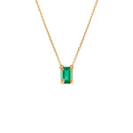 Paola Vilas 18k gold necklace with sculpted hands holding an emerald