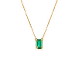 Paola Vilas 18k gold necklace with sculpted hands holding an emerald