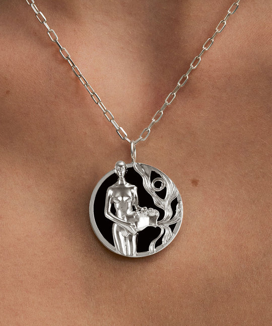 Model wearing Aquarius zodiac necklace in sterling silver