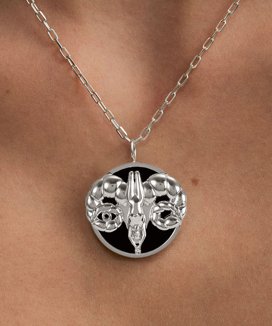 Model wearing Aries zodiac necklace in sterling silver
