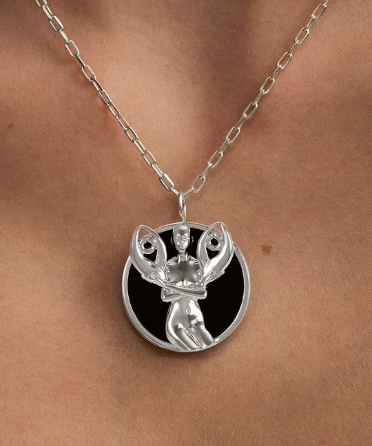 Model wearing Cancer zodiac necklace in sterling silver