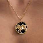 Model wearing Leo zodiac necklace in sterling silver with 18k gold plating