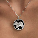 Model wearing Leo zodiac necklace in sterling silver