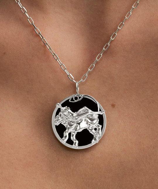 Model wearing Leo zodiac necklace in sterling silver