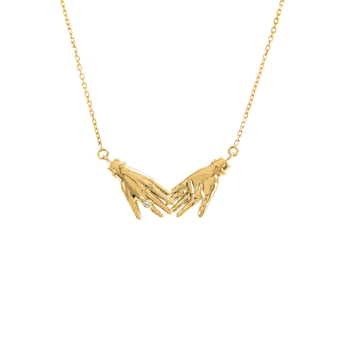 Paola Vilas mini necklace in 18k gold of hands with diamond