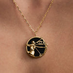 Model wearing Sagittarius zodiac necklace in sterling silver with 18k gold plating