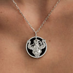 Model wearing Taurus zodiac necklace in sterling silver