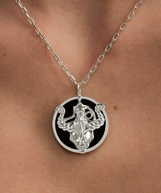 Model wearing Taurus zodiac necklace in sterling silver