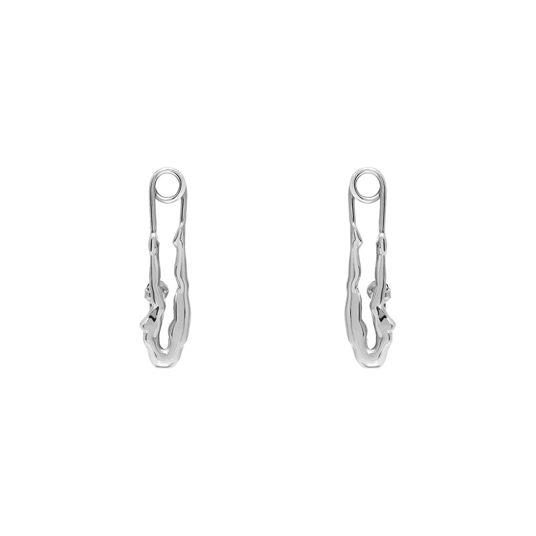 Paola Vilas earring in sterling silver featuring a safety pin and female body